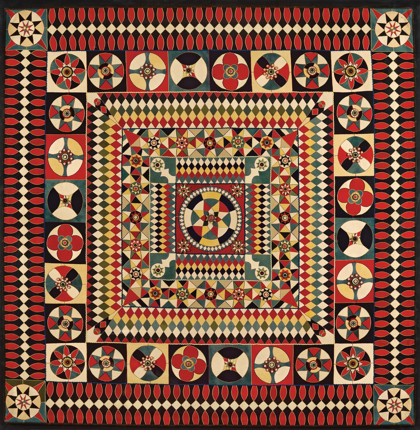 The artist of this wool soldier’s quilt is unknown. The quilt was created in 1850-75 in India and is probably from military uniforms with embroidery thread, rickrack and velvet binding. It is hand-embroidered and has an inlaid, layered-applique.